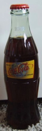 6028-€ 15,00 coca cola fles world of cc 2002